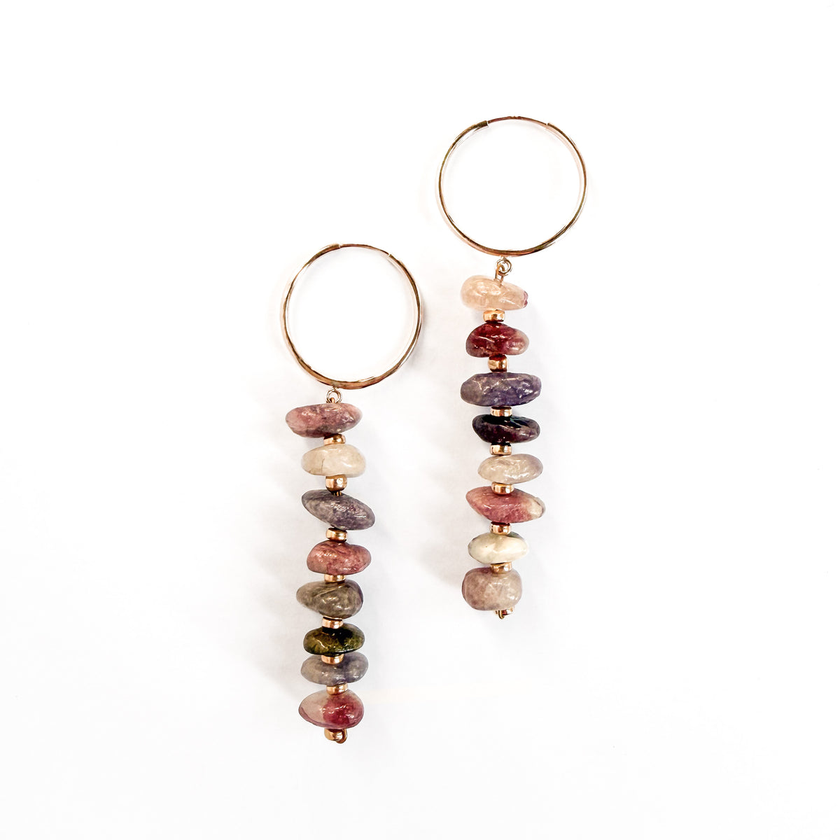 A pair of dangle earrings featuring hammered gold-filled hoops and dangling chains of polished, irregular multicolor gemstone beads, shown on a plain white background.