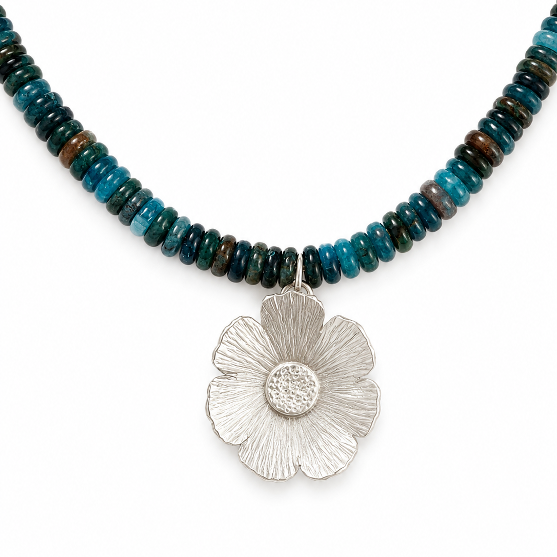 Blue apatite gemstone necklace with a handcrafted floral pendant in sterling silver.