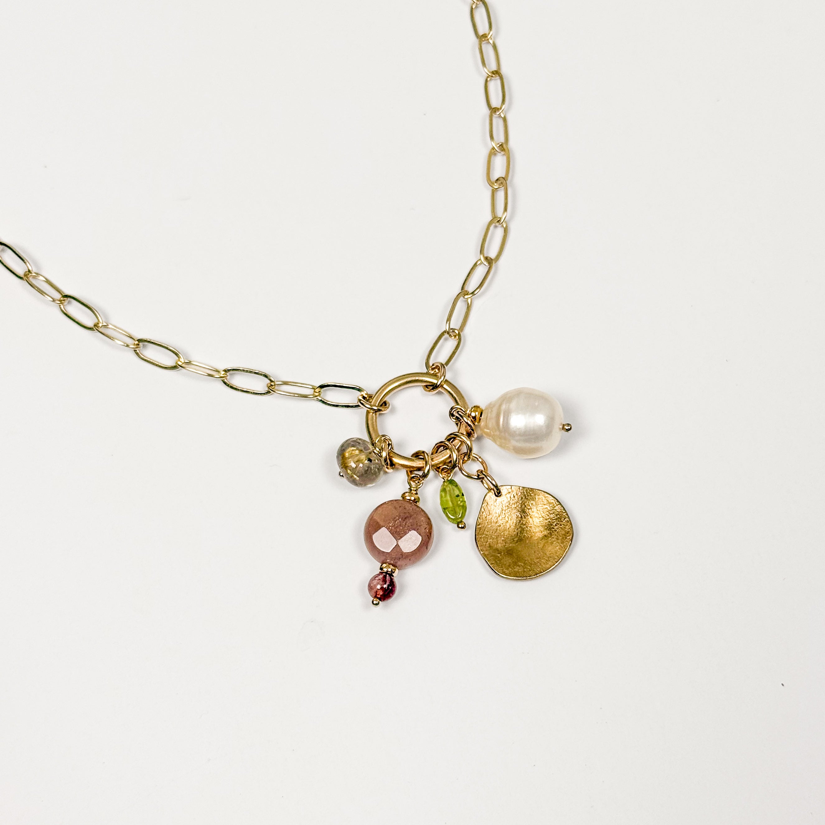 August gemstone charm necklace with freshwater pearl, natural gemstones and hand-formed brass pebble