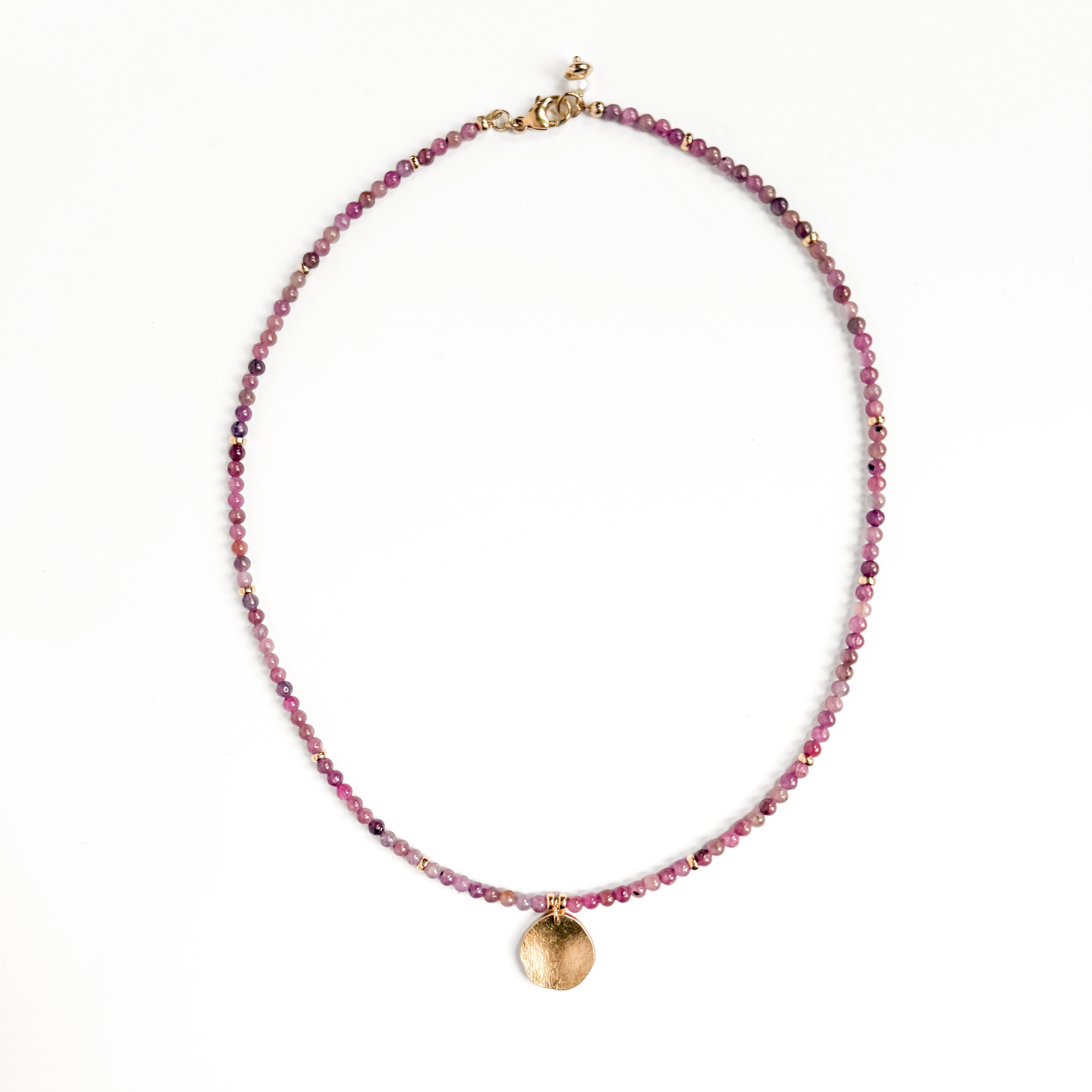 Cerise natural ruby necklace with hand-formed brass pebble pendant and 14k gold-filled details